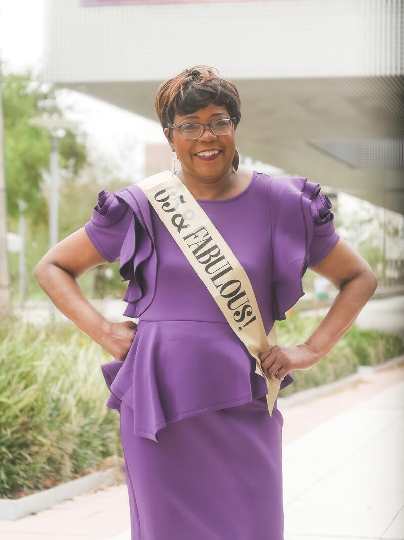 Woman celebrating her 65th birthday at the park.